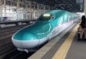 Front portside view of an incoming Japanese Shinkansen high-speed train